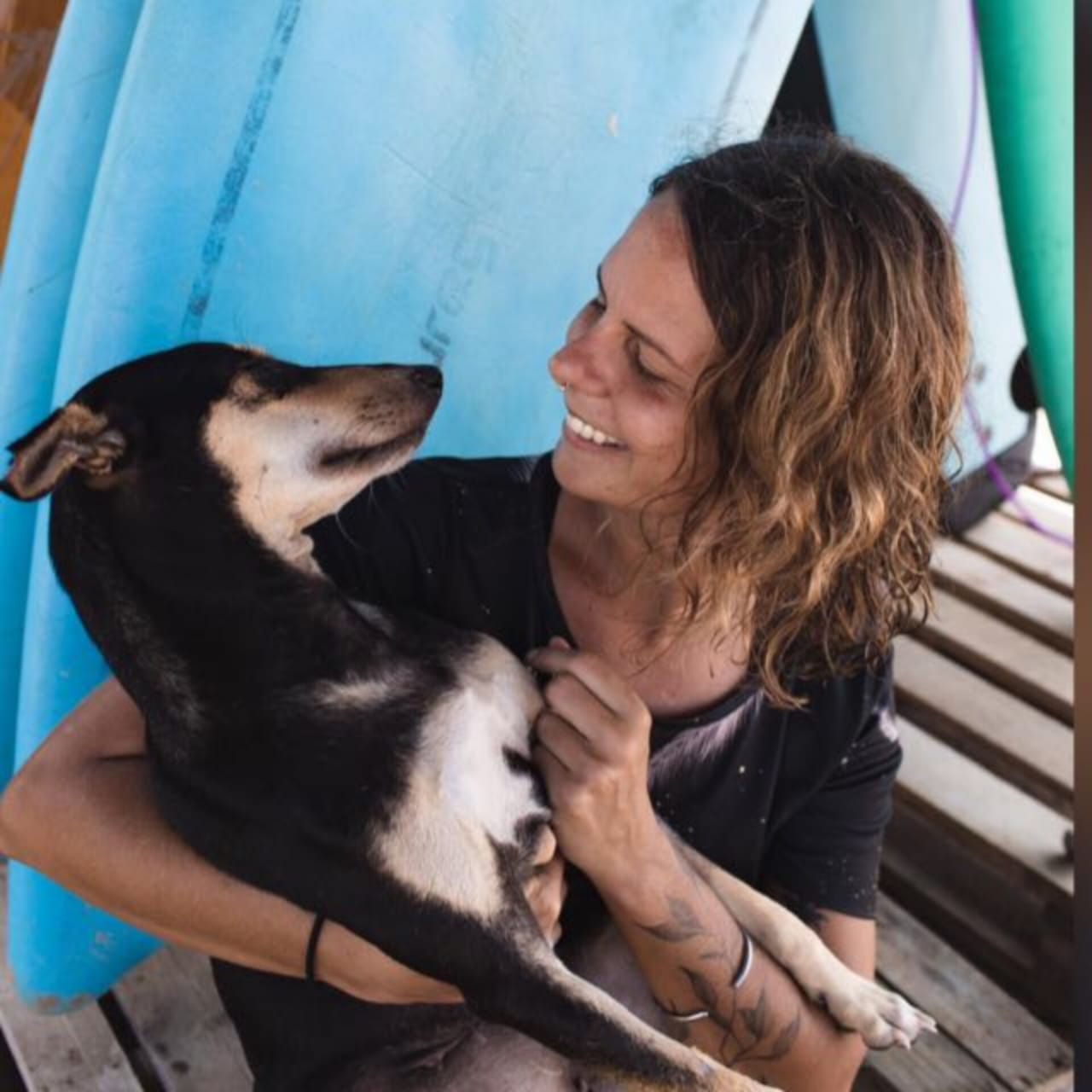 Vanessa sharing a quiet moment with a dog